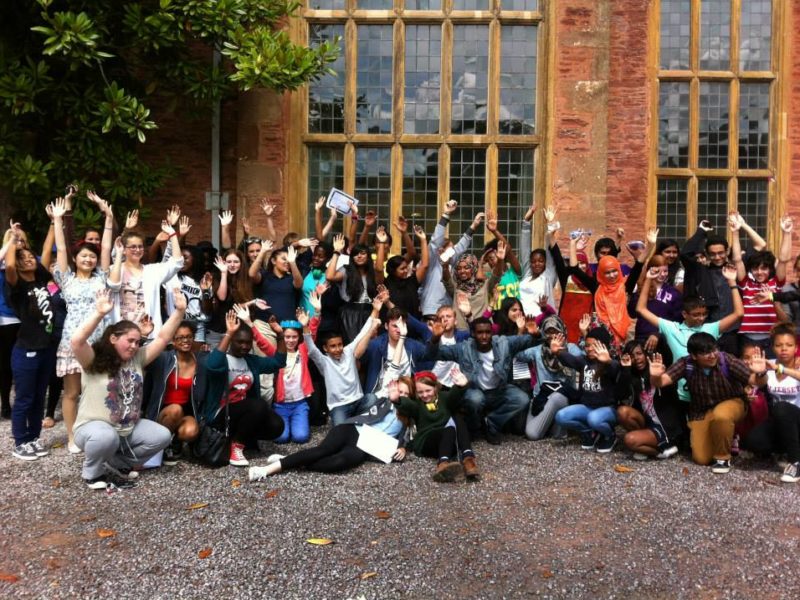 Young writers outside Nettlecombe at the 2013 First Story Residential