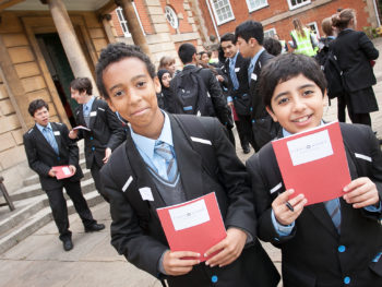 Two boys with First Story notebooks