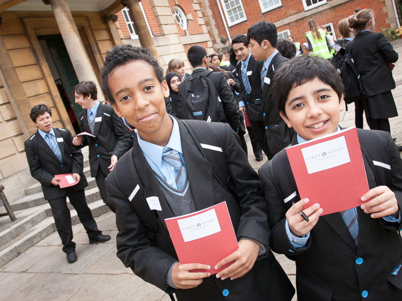 Two boys with First Story notebooks