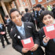 Two boys with First Story notebooks